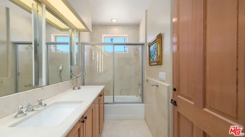 an aerial view of lake and residential houses with outdoor space