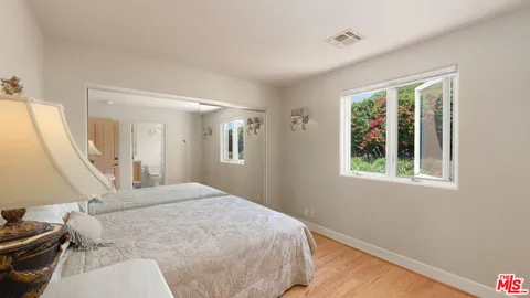 a swimming pool view with a garden space