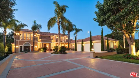 a patio with a yard table and chairs