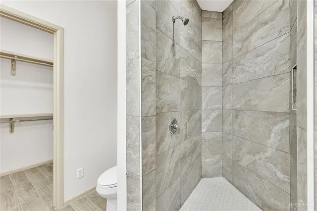 a bathroom with a granite countertop sink mirror and double