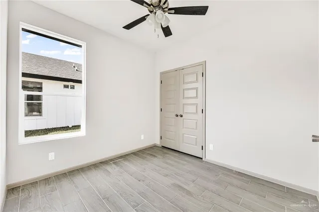 a kitchen with stainless steel appliances granite countertop a sink a stove and cabinets