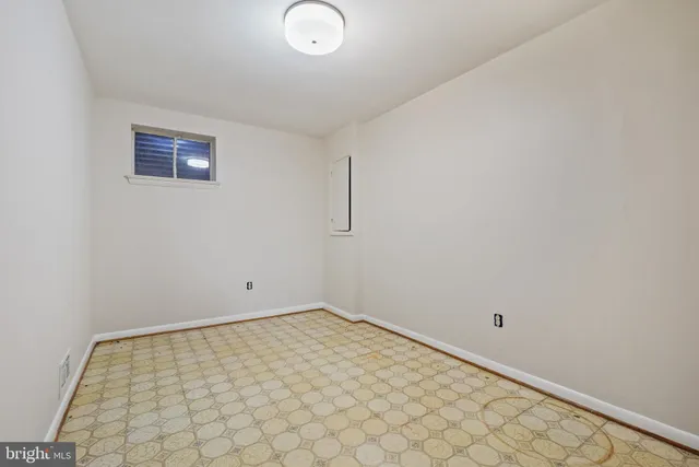 an empty room with wooden floor