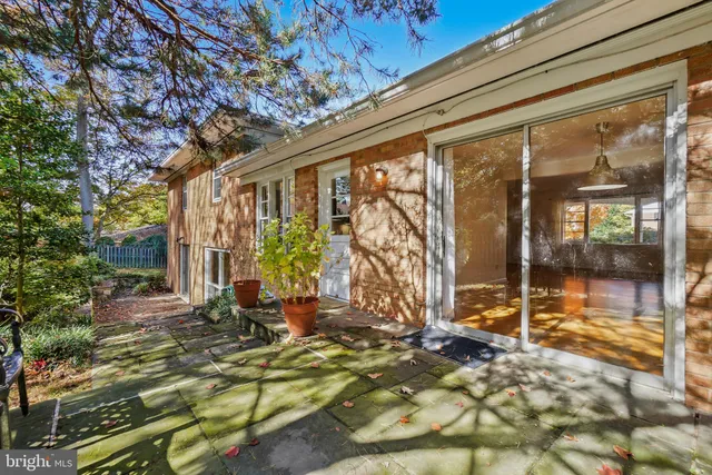 a view of backyard with patio