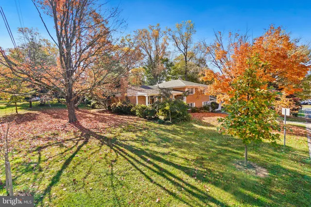a view of yard with swimming pool and trees