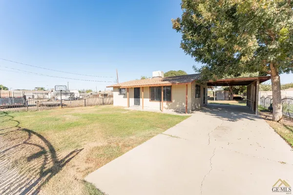 a swimming pool with outdoor seating and yard