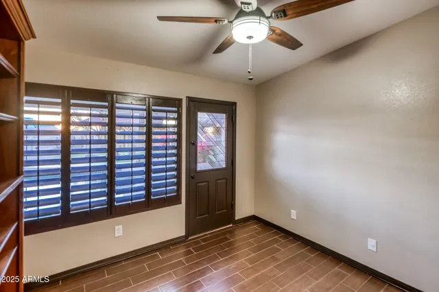 a view of a patio with chairs and a table
