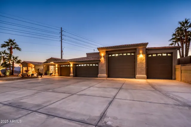 a large kitchen with stainless steel appliances granite countertop a stove and cabinets