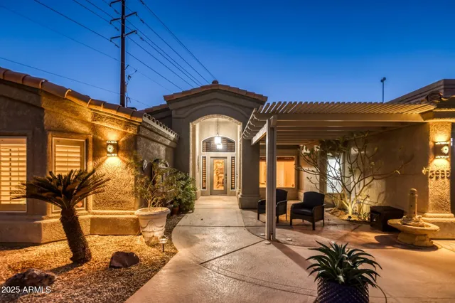 a kitchen with stainless steel appliances granite countertop a sink and wooden cabinets