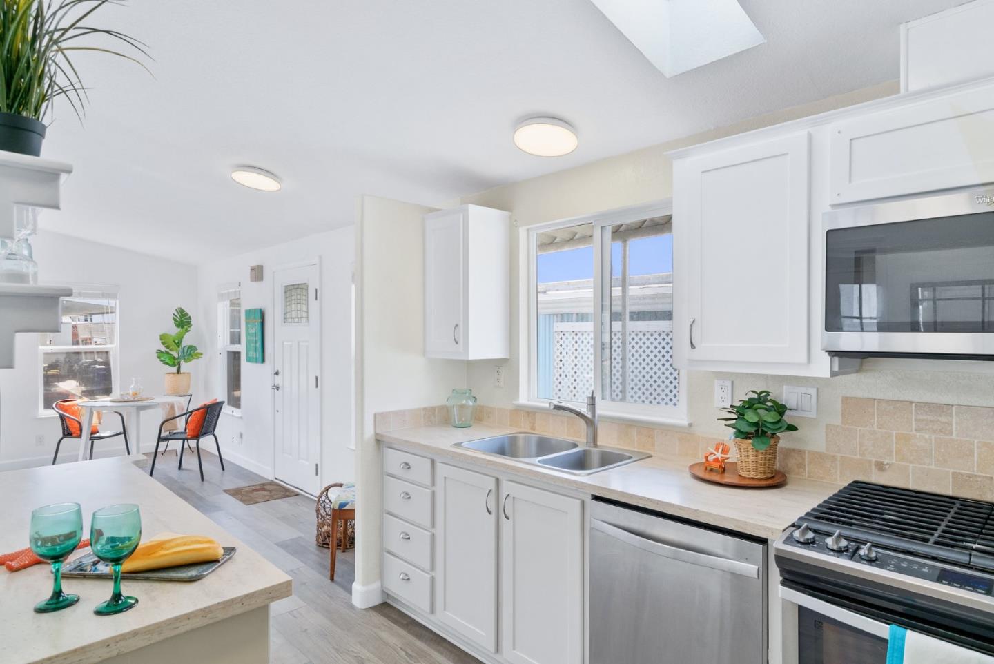 100 North Rodeo Gulch Road, Unit 65 Soquel, CA 95073 - Photo 13 of 33 a kitchen that has a sink and a stove in it