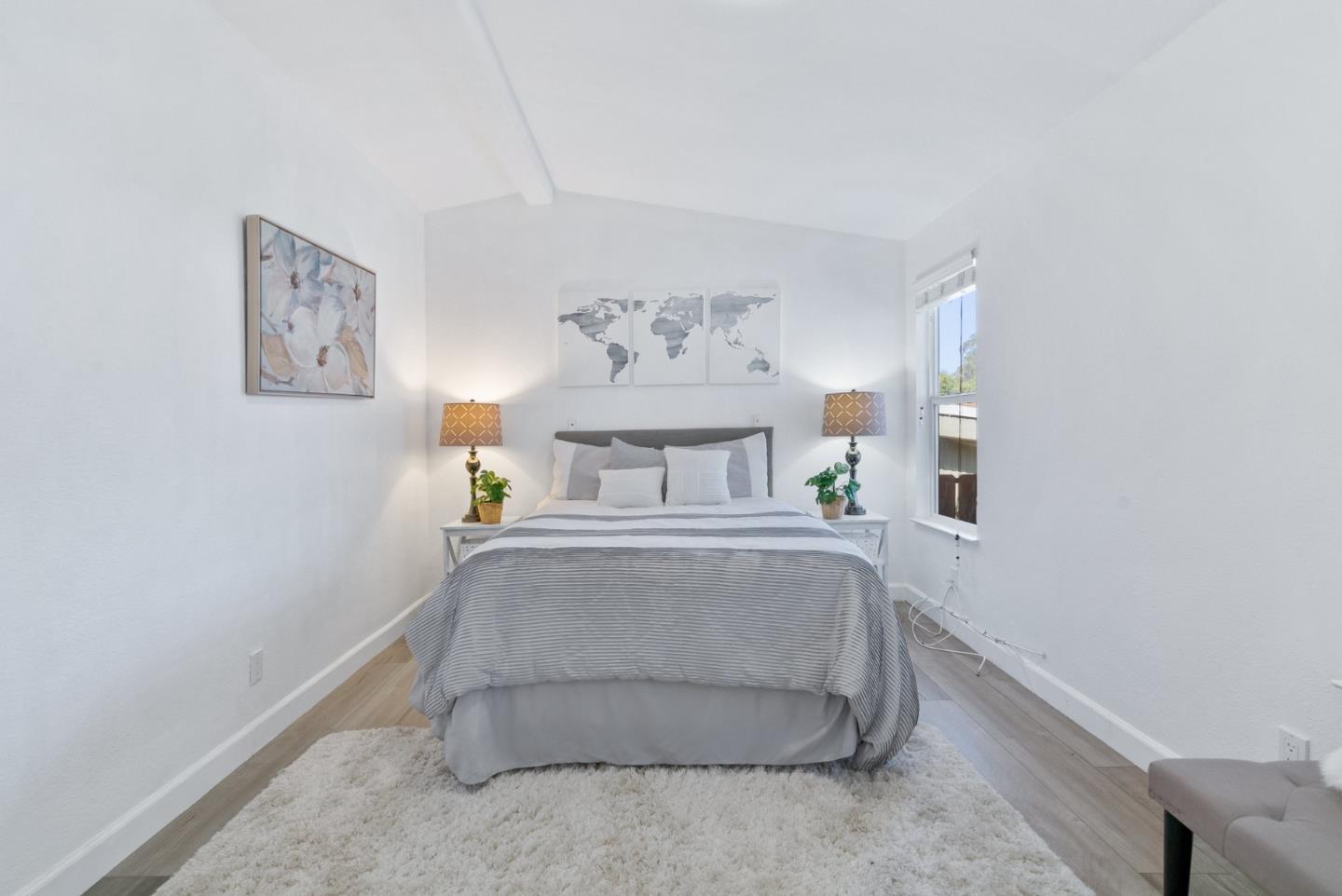 100 North Rodeo Gulch Road, Unit 65 Soquel, CA 95073 - Photo 20 of 33 a bedroom with a bed and a painting on the wall