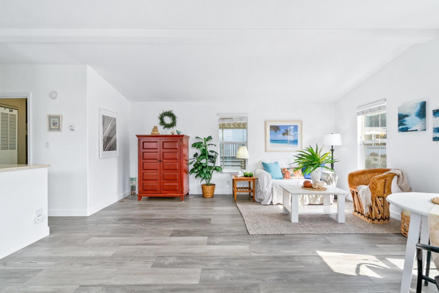 100 North Rodeo Gulch Road, Unit 65 Soquel, CA 95073 - Photo 2 of 33 a living room with furniture and wooden floor