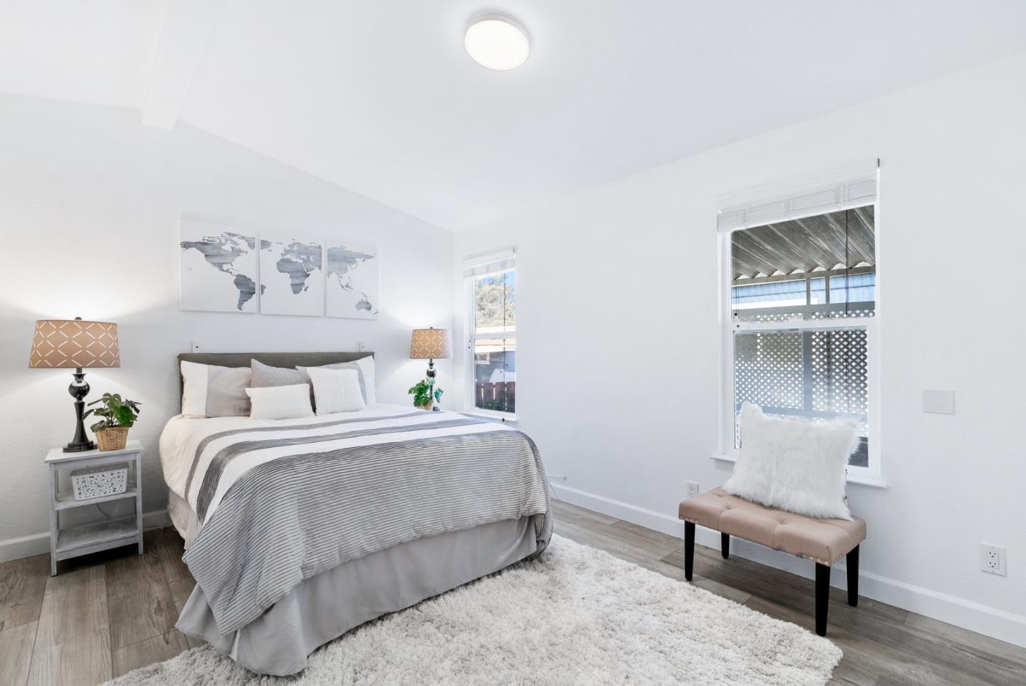 100 North Rodeo Gulch Road, Unit 65 Soquel, CA 95073 - Photo 21 of 33 a bedroom with a bed and a couch