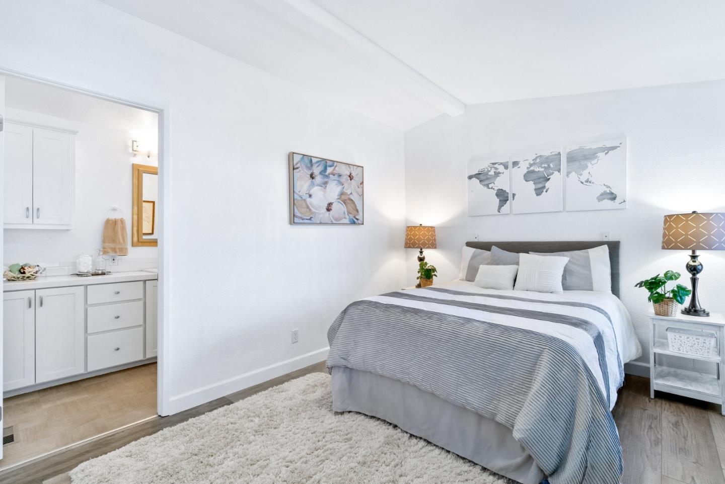 100 North Rodeo Gulch Road, Unit 65 Soquel, CA 95073 - Photo 22 of 33 a spacious bedroom with a bed and a cabinets