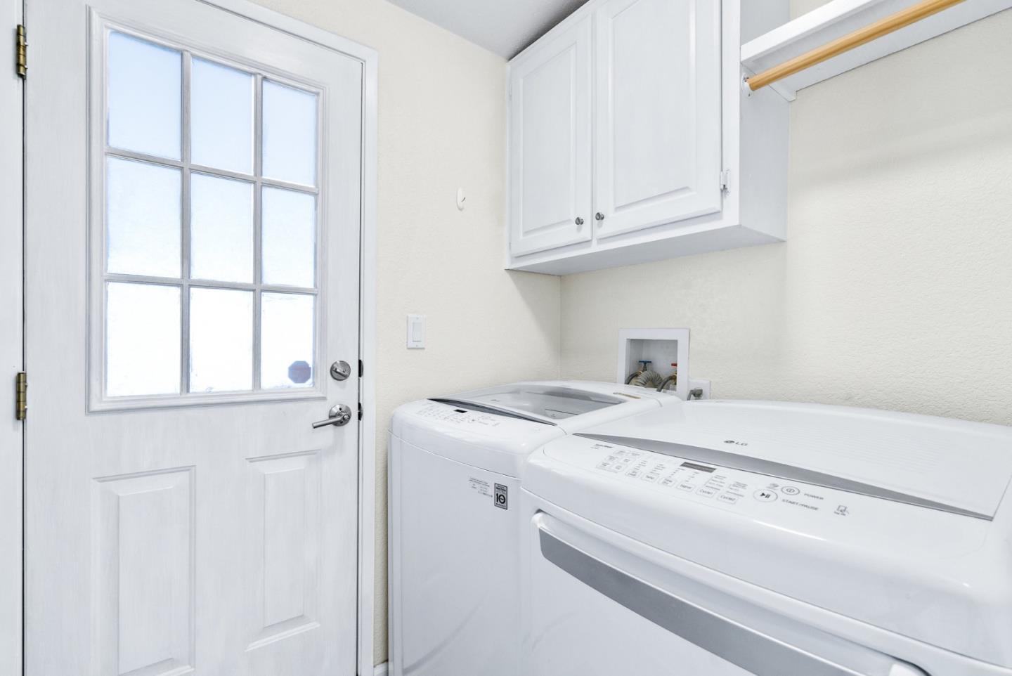 100 North Rodeo Gulch Road, Unit 65 Soquel, CA 95073 - Photo 25 of 33 a utility room with a sink dryer and washer