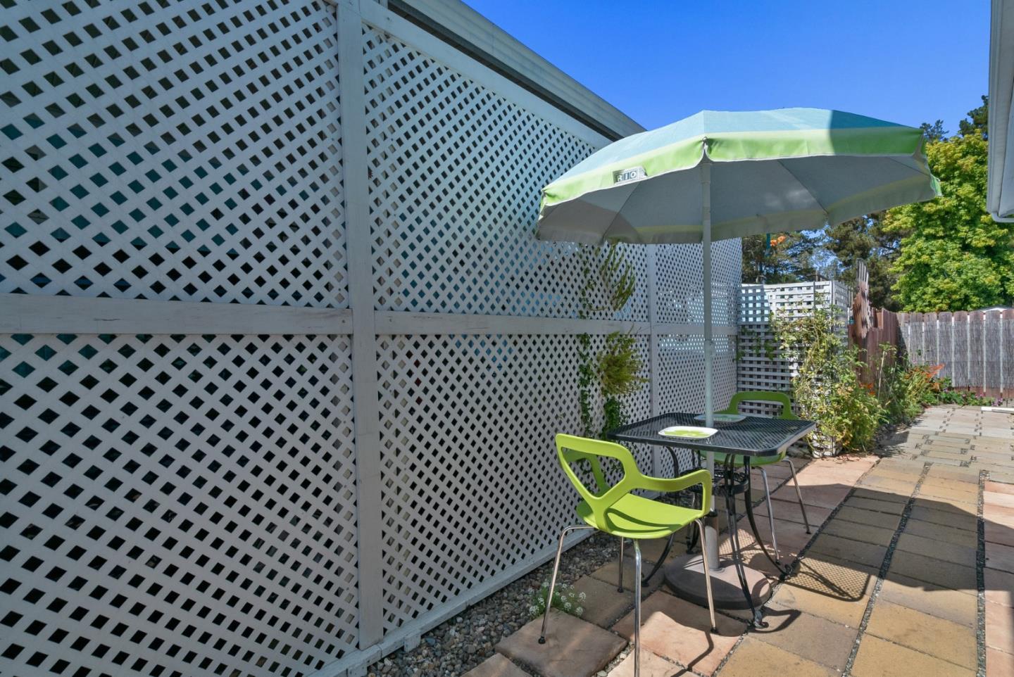 100 North Rodeo Gulch Road, Unit 65 Soquel, CA 95073 - Photo 26 of 33 a view of a chairs and table in backyard