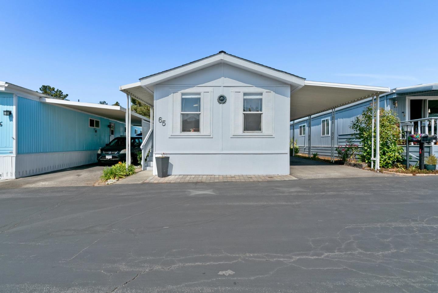 100 North Rodeo Gulch Road, Unit 65 Soquel, CA 95073 - Photo 32 of 33 a front view of a house with a road