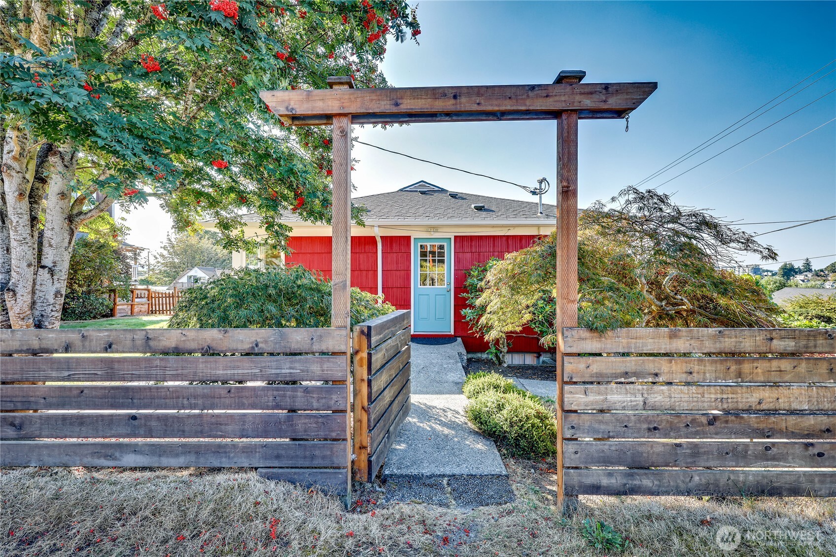 a view of a wooden door and a bench in a yard