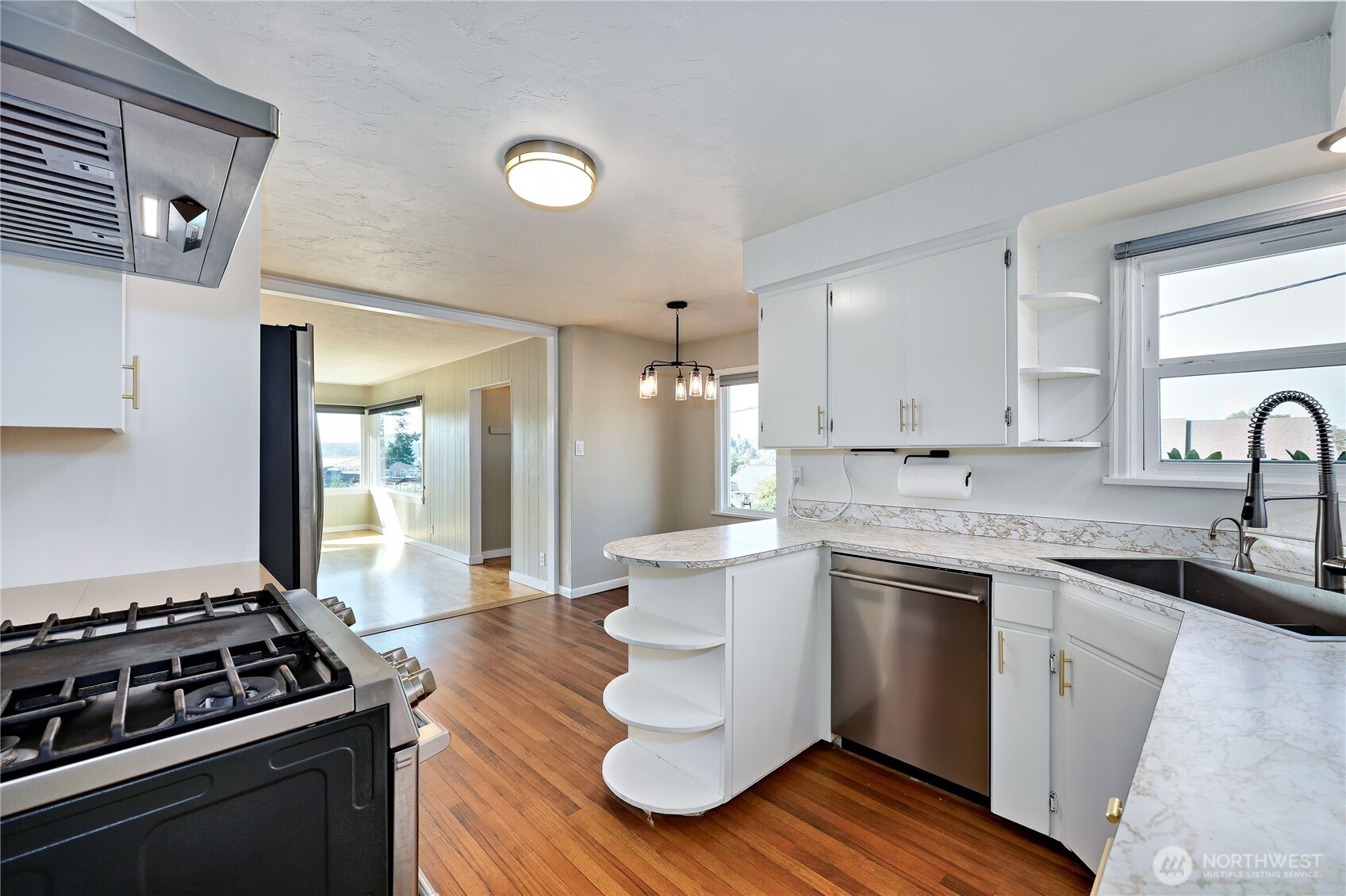 1518 Winfield Avenue Bremerton, WA 98310 - Photo 15 of 38 a kitchen with a stove and white cabinets