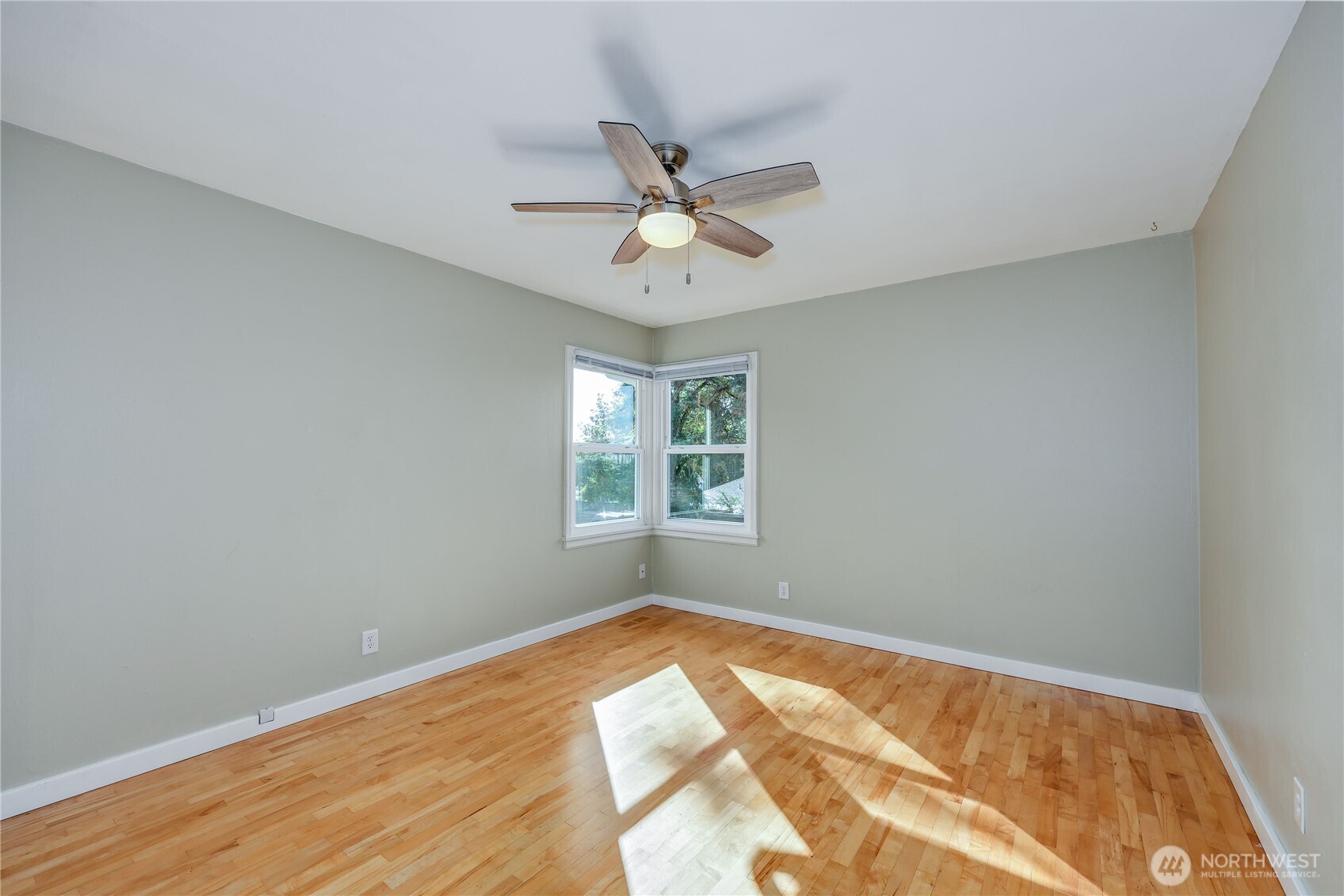 1518 Winfield Avenue Bremerton, WA 98310 - Photo 19 of 38 a view of empty room with wooden floor and fan