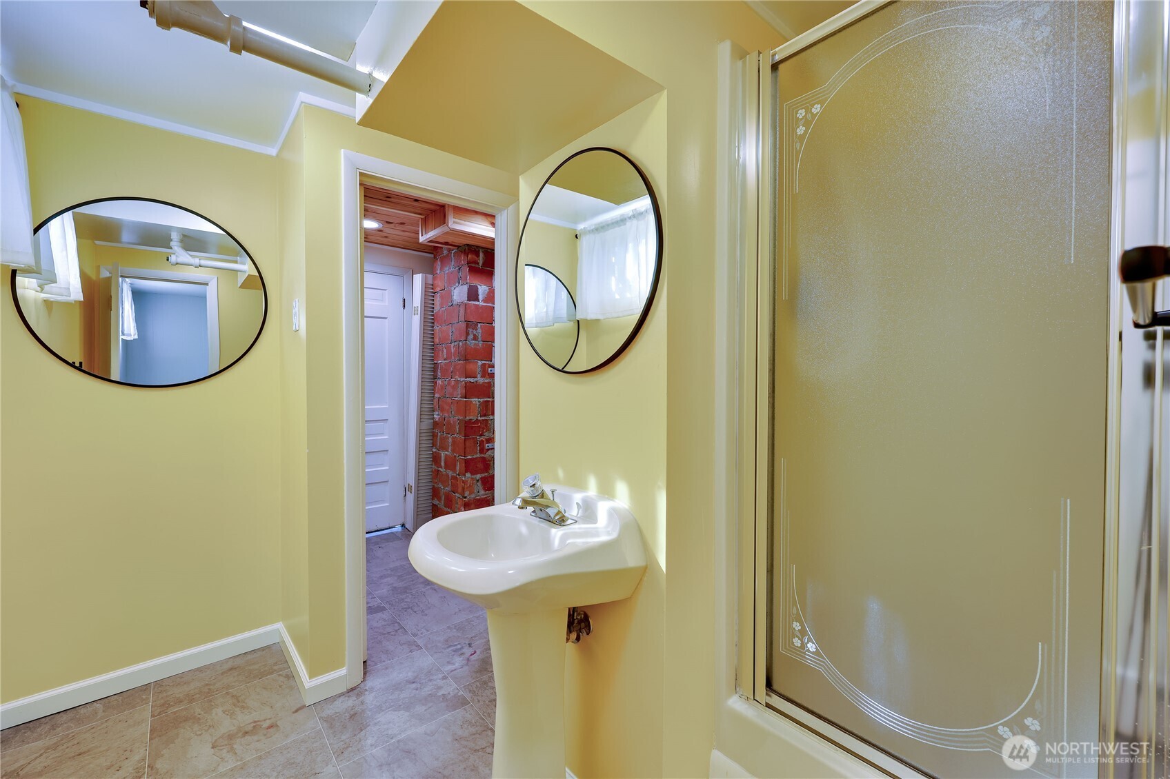 1518 Winfield Avenue Bremerton, WA 98310 - Photo 28 of 38 a bathroom with a sink and a mirror