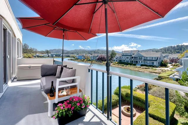 an outdoor space with furniture and umbrella