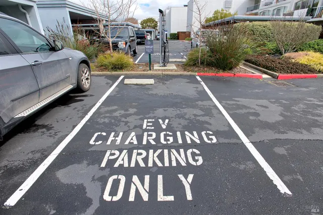 a view of street with parked cars