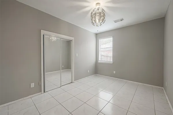 a view of an empty room and a window