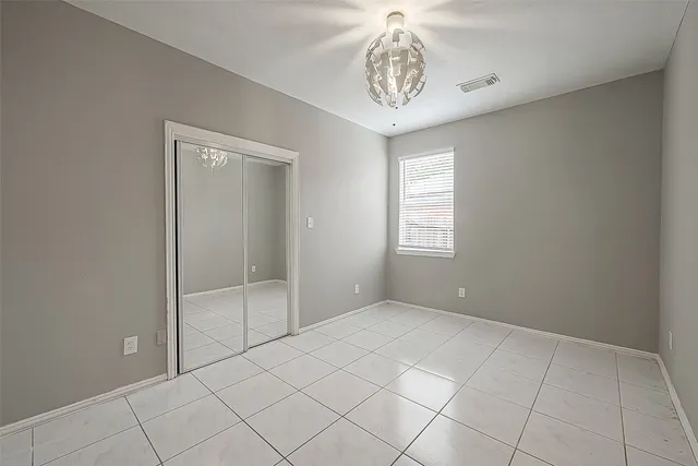 a view of an empty room and a window