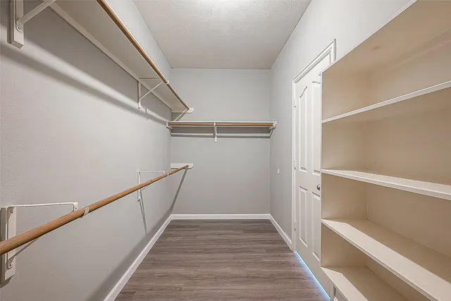 a view of a hallway with windows