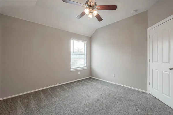 a view of a chandelier fan in a room