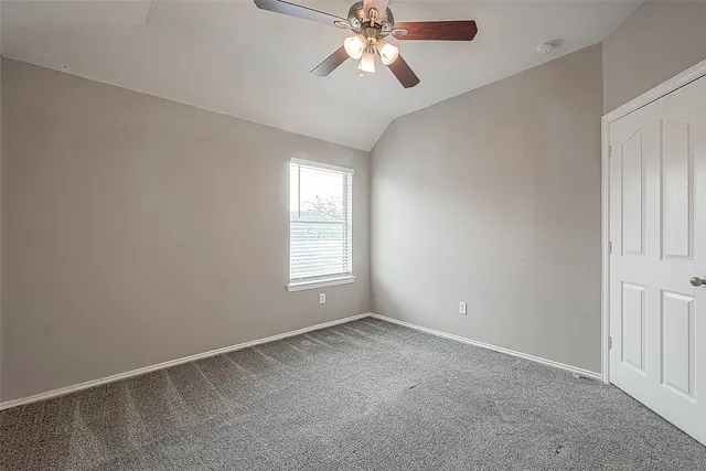 a view of a chandelier fan in a room