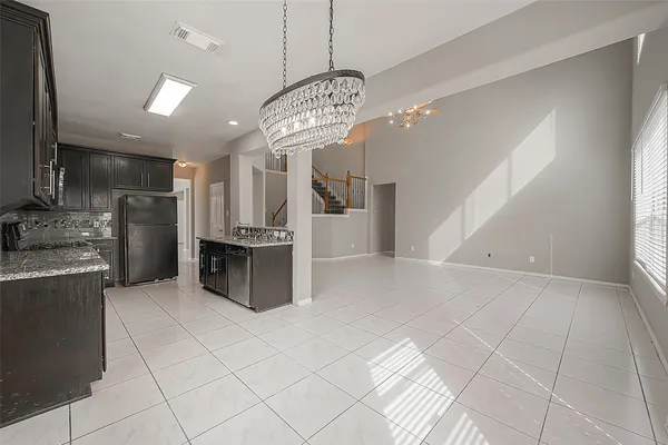 a kitchen with stainless steel appliances a refrigerator and a sink