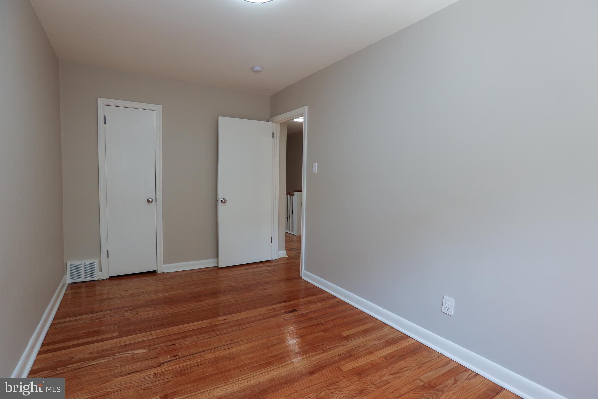 607 Briarcliff Road Upper Darby, PA 19082 - Photo 14 of 23 a view of an empty room with wooden floor