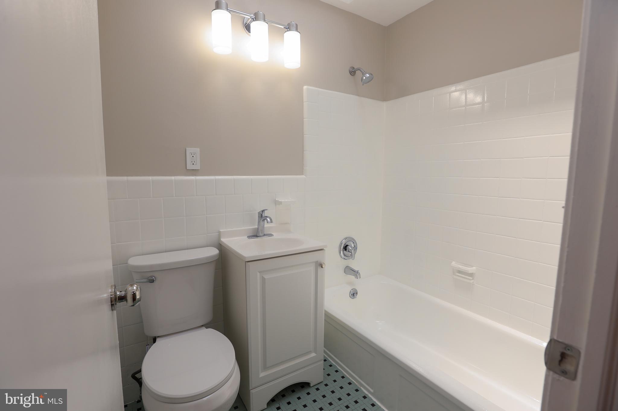 607 Briarcliff Road Upper Darby, PA 19082 - Photo 19 of 23 a bathroom with a sink a toilet and shower