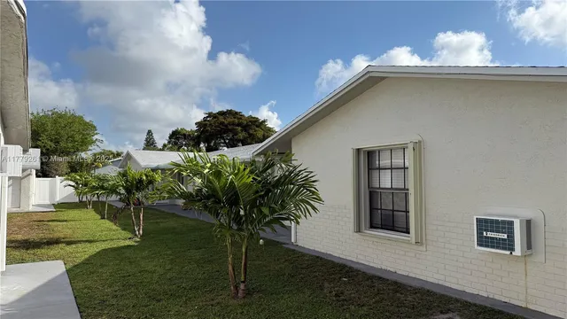 a house view with a garden space