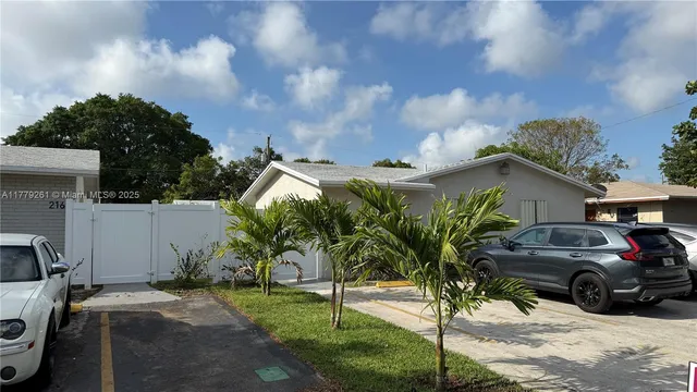 a view of a car parked in front of a house