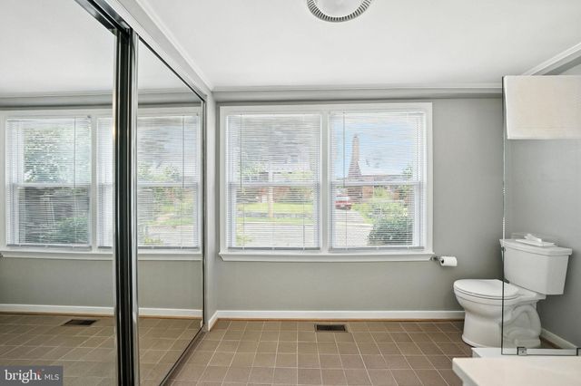 a bathroom with a toilet sink and a shower