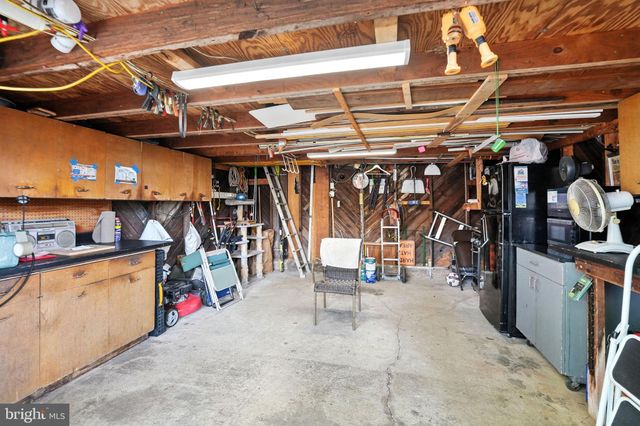 a view of a backyard with a small cabin