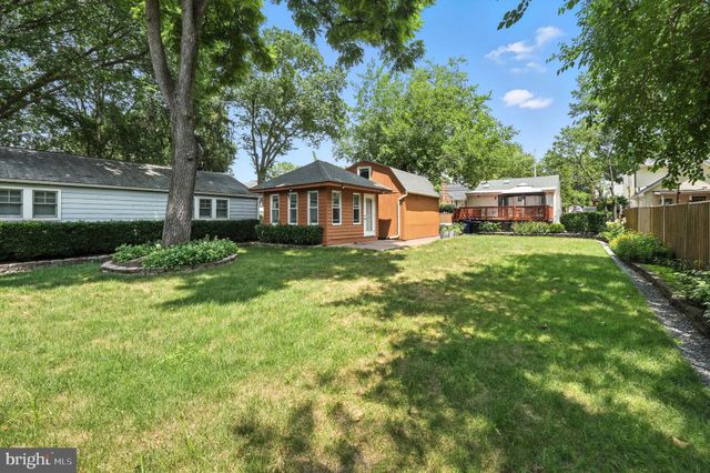 a view of a house with a yard porch and sitting area