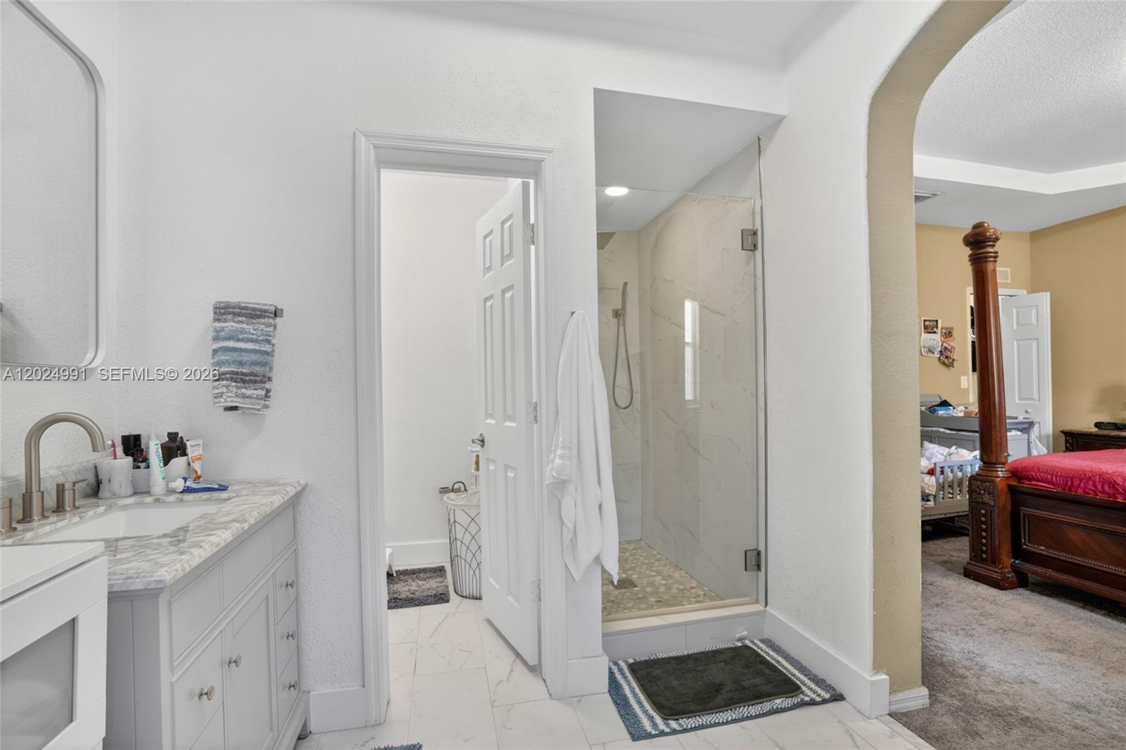 16651 Southwest 79th Terrace Miami, FL 33193 - Photo 14 of 34 a bathroom with a sink a toilet and shower