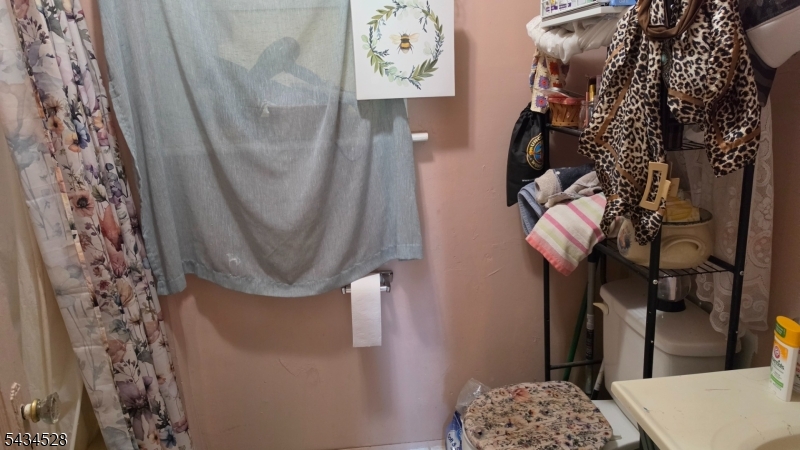 1115 West Camplain Road Manville, NJ 08835 - Photo 18 of 18 a bathroom with a sink and a mirror