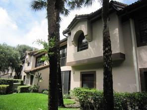 5438 Verona Drive, Unit 812 Boynton Beach, FL 33437 - Photo 19 of 35 a front view of a house with a garden