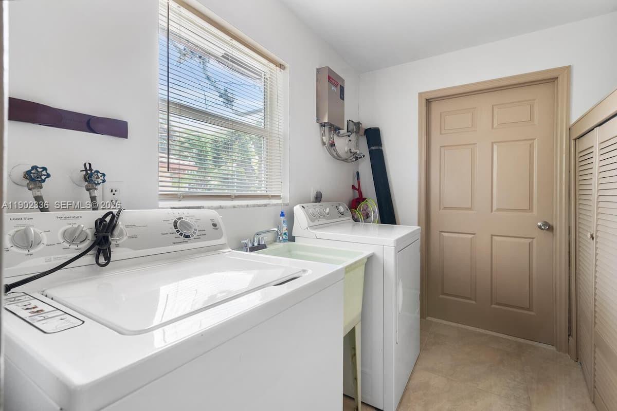 1500 Northwest 45th Street Pompano Beach, FL 33064 - Photo 19 of 23 a bedroom with a bed and a window