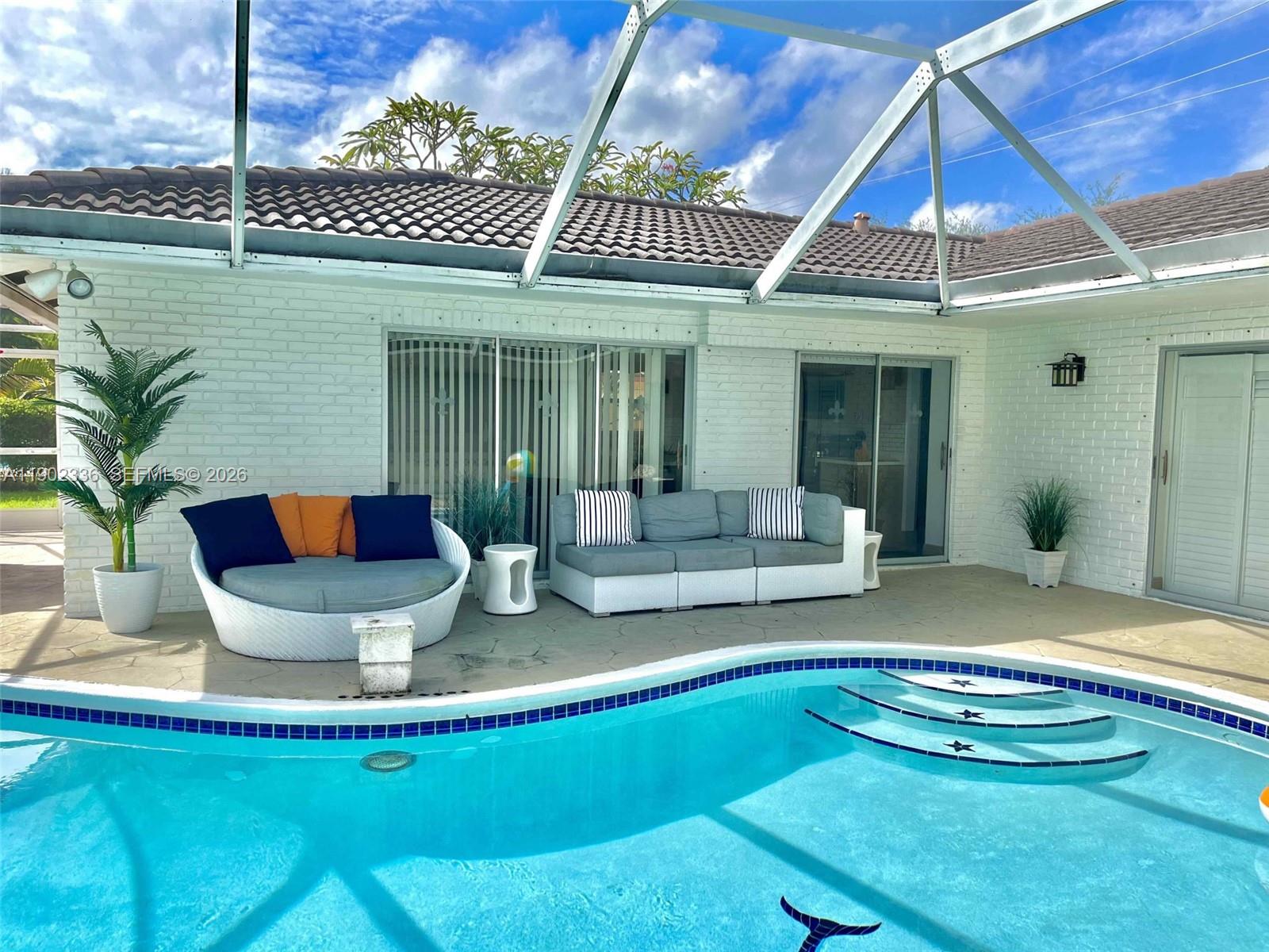 1500 Northwest 45th Street Pompano Beach, FL 33064 - Photo 22 of 23 a view of a house with pool