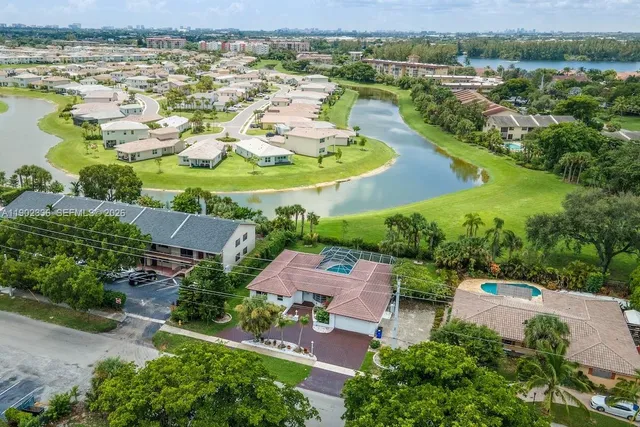 an aerial view of a house with a lake view