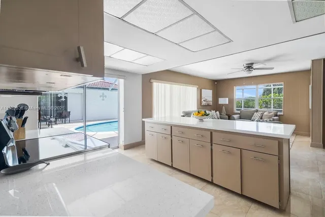 a spacious bathroom with a double vanity sink and a large mirror