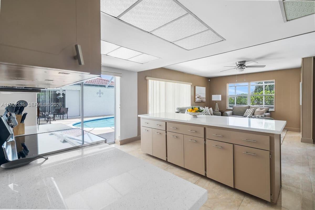 1500 Northwest 45th Street Pompano Beach, FL 33064 - Photo 9 of 23 a spacious bathroom with a double vanity sink and a large mirror