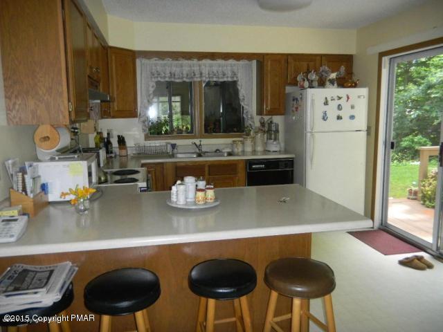 367 Coach Road Tobyhanna, PA 18466 - Photo 13 of 21 a kitchen with a table and chairs in it