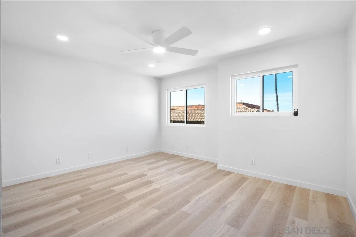 955 Postal Way, Unit 29 Vista, CA 92083 - Photo 12 of 32 wooden floor in an empty room with a window