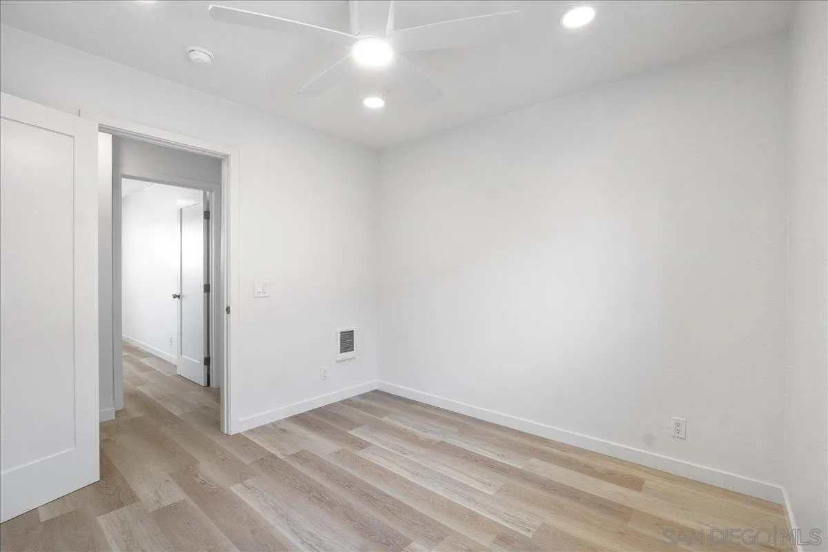 955 Postal Way, Unit 29 Vista, CA 92083 - Photo 18 of 32 a view of a room with wooden floor